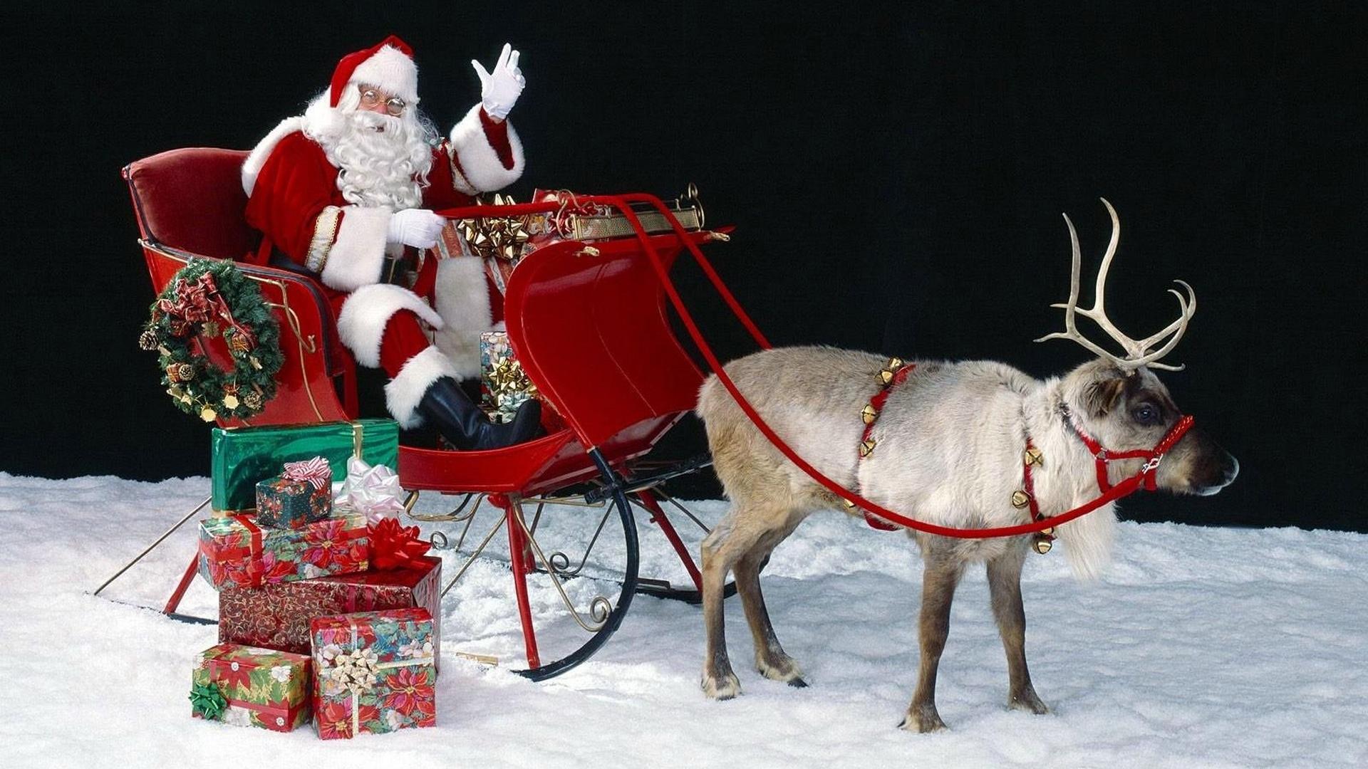 Santa On His Sleigh With Reindeer